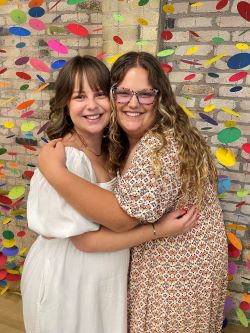 Ashley and sister similing.